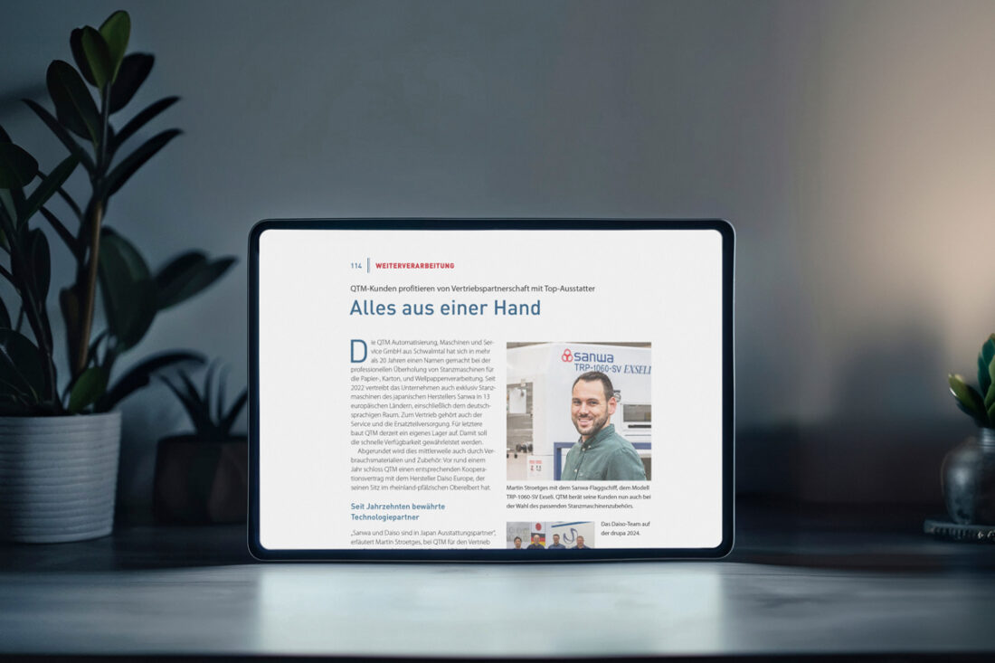 Pressebericht über QTM in der grafischen Palette auf einem Tablet